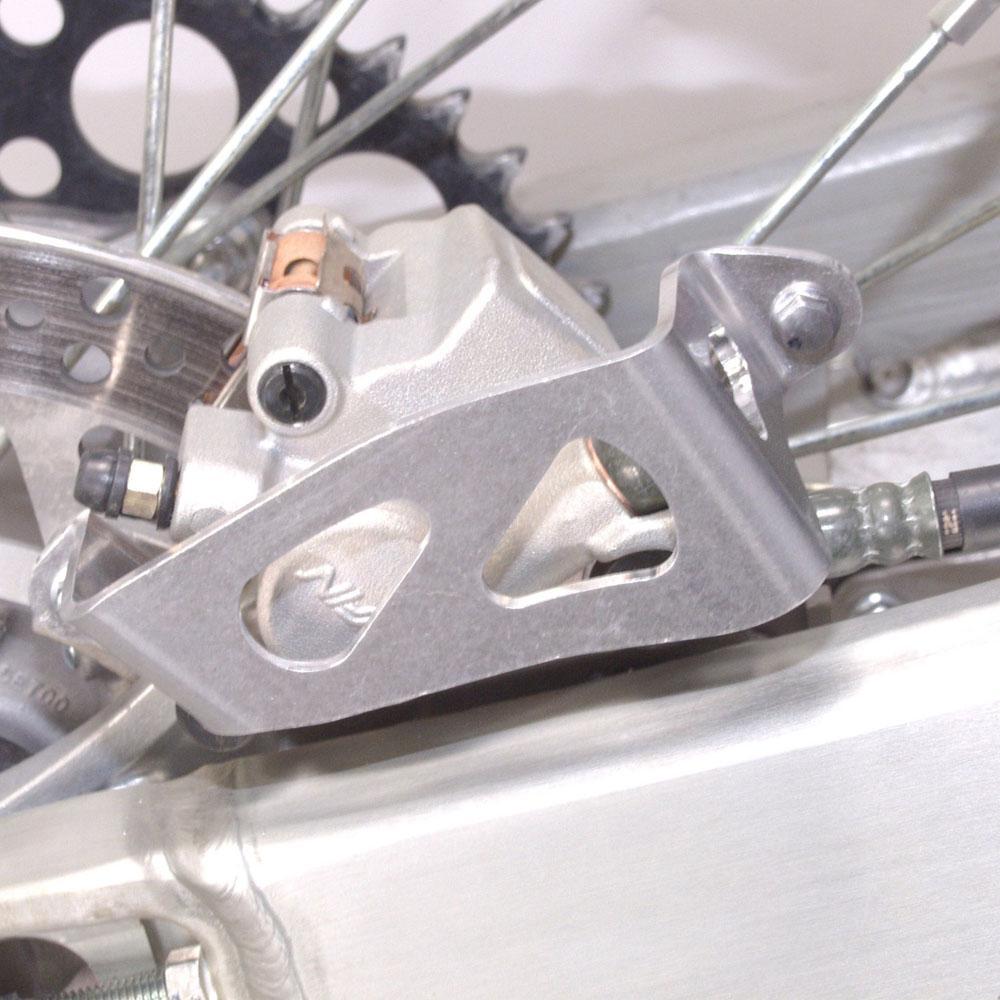 25-033 - Works Connection Rear Brake Caliper Guard For Yamaha YZ 125/250 2006-2021, YZF 250/450 2006-2020, YZF250X 2015-2021, YZF450X 2016-2020, WRF250 2006-2023, WRF450 2006-2025